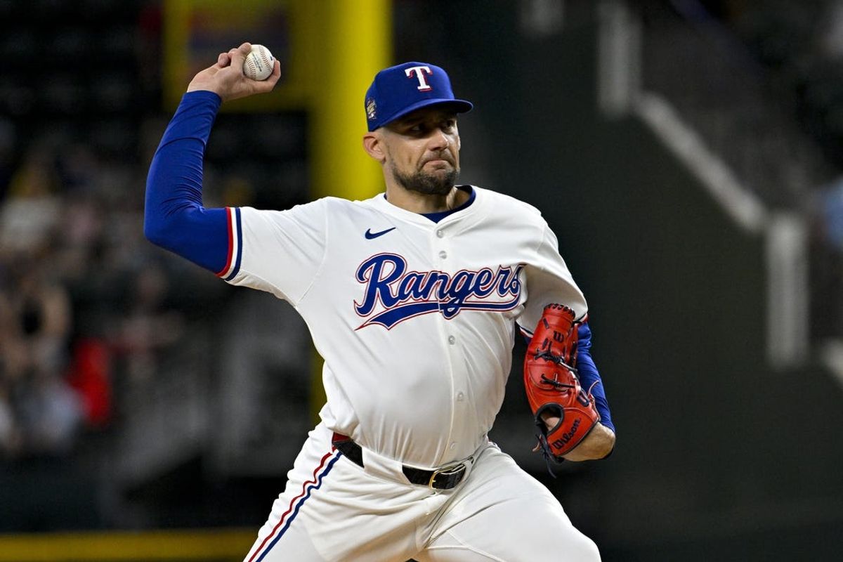 May 2, 2024; Arlington, Texas, USA; Texas Rangers starting pitcher Nathan Eovaldi (17) pitches against the Washington Nationals during the first inning at Globe Life Field. Mandatory Credit: Jerome Miron-USA TODAY Sports