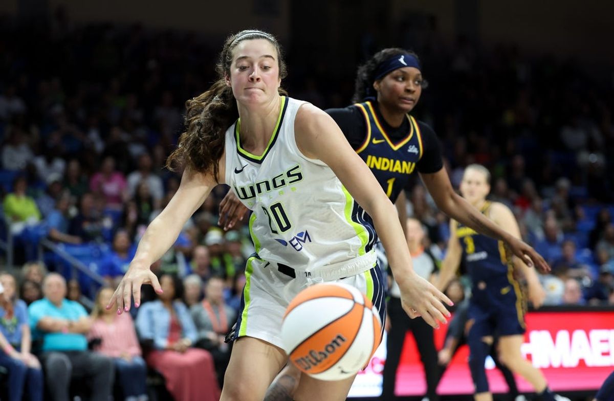 May 3, 2024; Dallas, Texas, USA; Dallas Wings forward Maddy Siegrist (20) goes for the ball in front of Indiana Fever forward NaLyssa Smith (1) during the second quarter at College Park Center.  Mandatory Credit: Kevin Jairaj-USA TODAY Sports