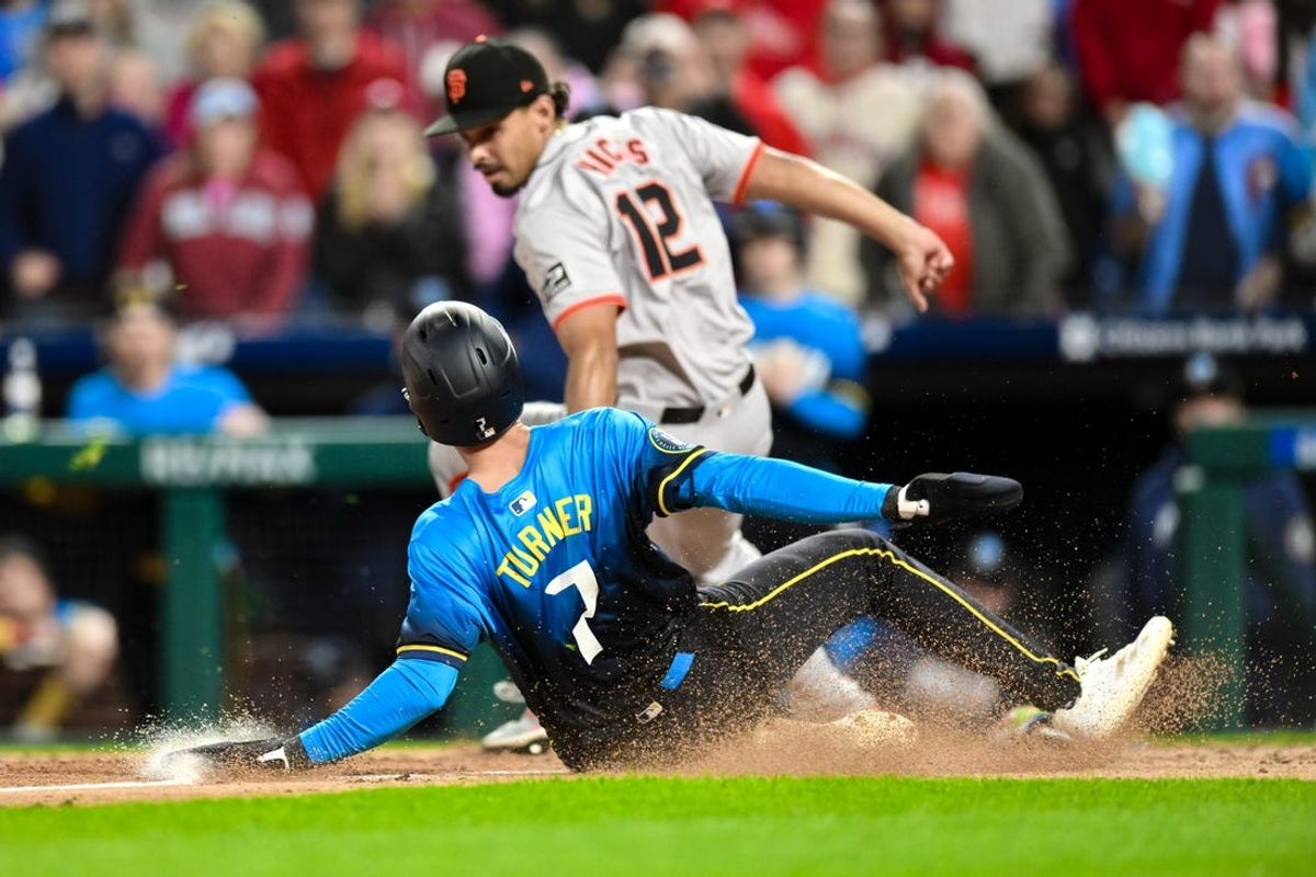 May 3, 2024; Philadelphia, Pennsylvania, USA; Philadelphia Phillies shortstop Trea Turner (7) scores a run ahead of the tag by San Francisco Giants pitcher Jordan Hicks (12) during the fourth inning at Citizens Bank Park. Mandatory Credit: John Jones-USA TODAY Sports