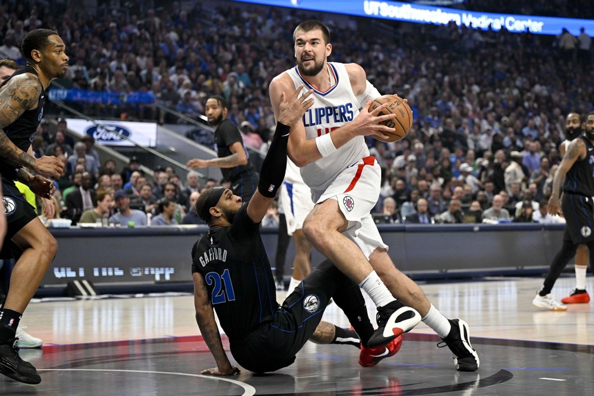 May 3, 2024; Dallas, Texas, USA; LA Clippers center Ivica Zubac (40) is fouled by Dallas Mavericks center Daniel Gafford (21) as he drives to the basket during the first quarter during game six of the first round for the 2024 NBA playoffs at American Airlines Center. Mandatory Credit: Jerome Miron-USA TODAY Sports