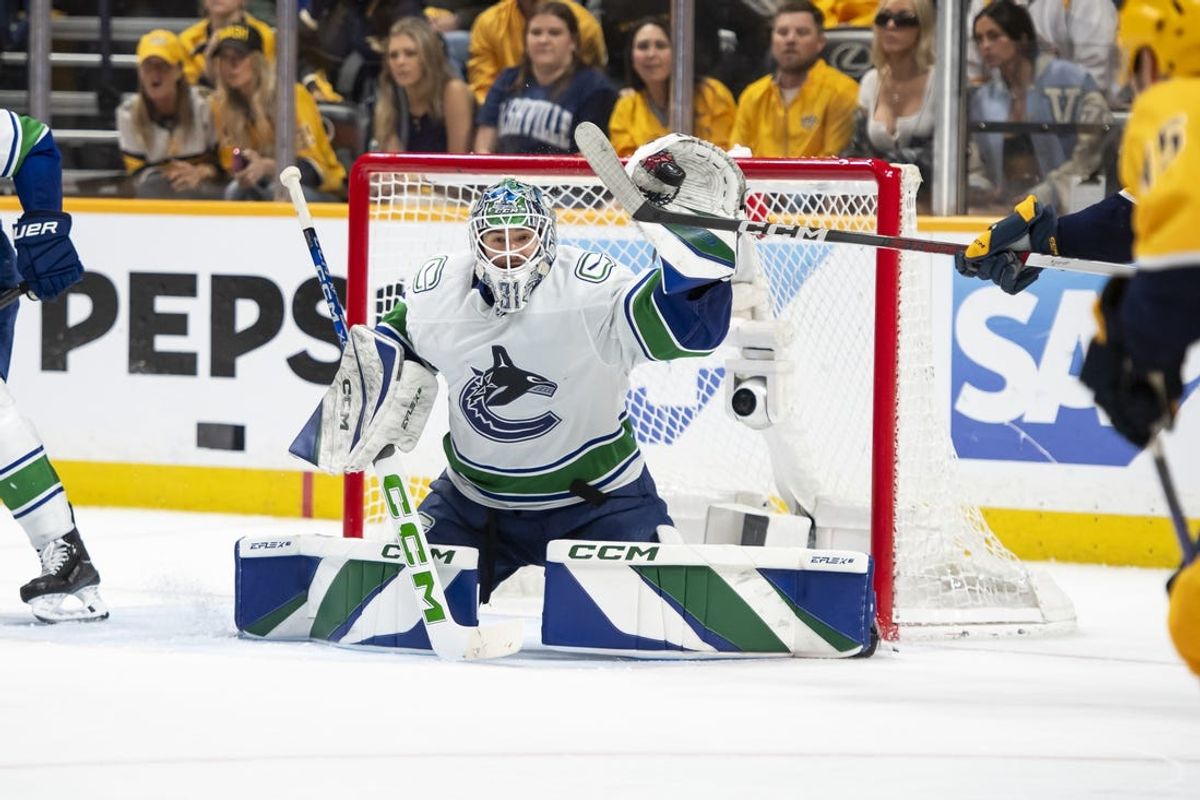 May 3, 2024; Nashville, Tennessee, USA; Vancouver Canucks goalkeeper Vancouver Canucks goalie Arturs Silovs (31) blocks the puck against the Nashville Predators during the third period in game six of the first round of the 2024 Stanley Cup Playoffs at Bridgestone Arena. Mandatory Credit: Steve Roberts-USA TODAY Sports