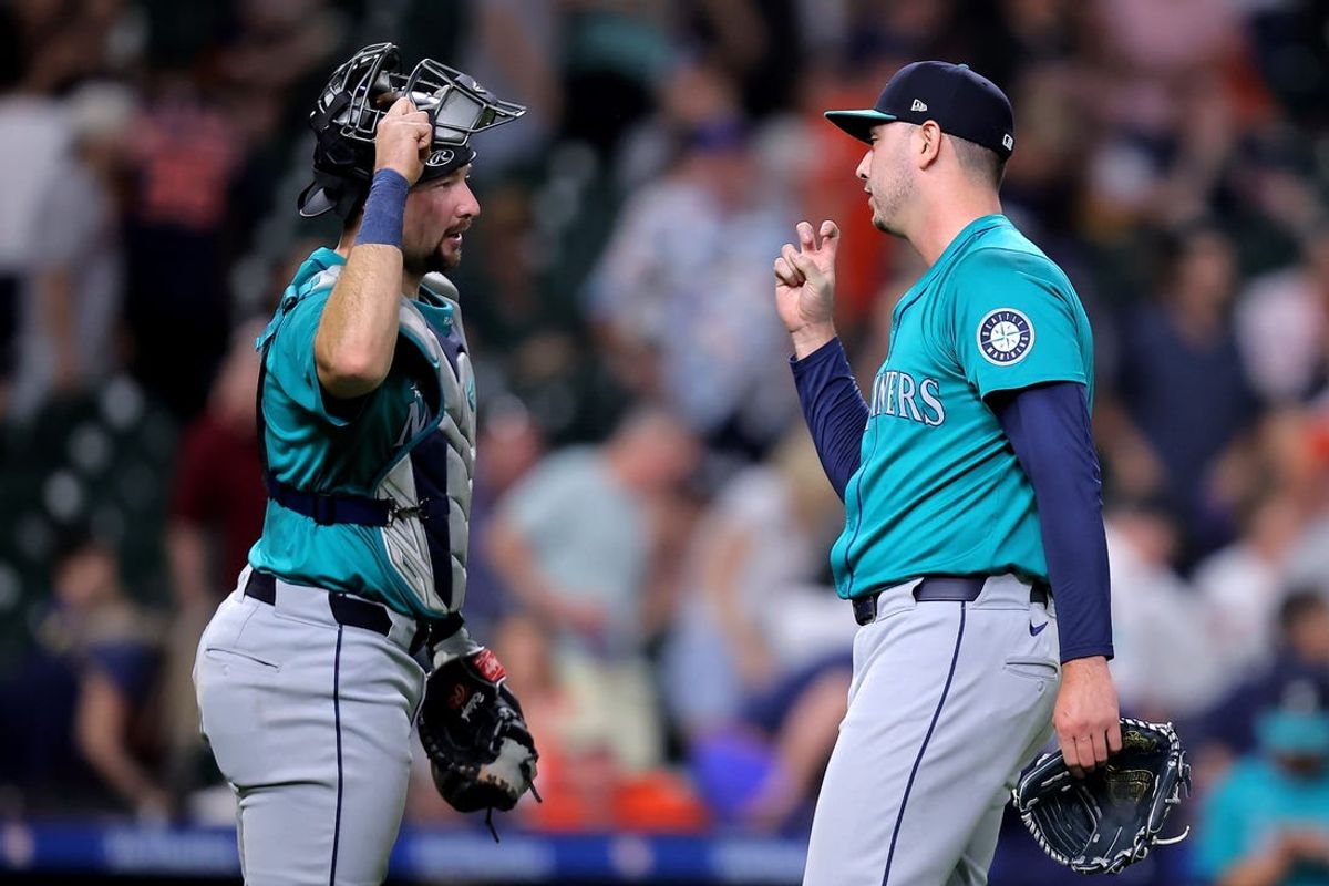 May 4, 2024; Houston, Texas, USA; Seattle Mariners pitcher Tayler Saucedo (60) celebrates with Cleveland Guardians pitcher Tim Herrin (29) after the final out against the Houston Astros during the ninth inning at Minute Maid Park. Mandatory Credit: Erik Williams-USA TODAY Sports