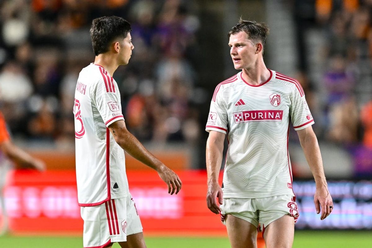 May 4, 2024; Houston, Texas, USA; St. Louis CITY SC midfielder Chris Durkin (8) speaks with defender Anthony Markanich (13) during the second half against Houston Dynamo FC at Shell Energy Stadium. Mandatory Credit: Maria Lysaker-USA TODAY Sports