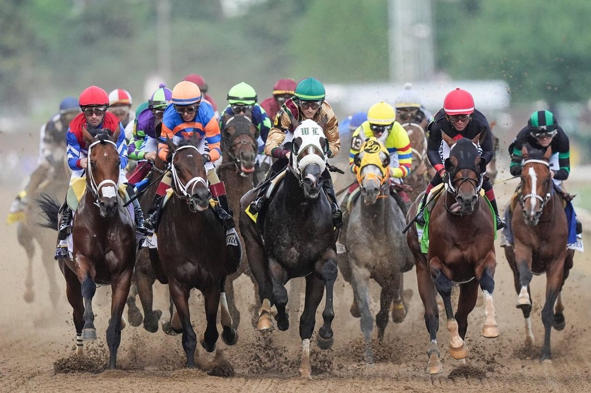 The field of 20 of the 2024 Kentucky Derby enter the first turn during the 150th Run For the Roses at Churchill Downs Saturday, May 4, 2024 in Louisville, Kentucky. At far right is eventually winner Mystik Dan ridden by Brian J. Hernandez.