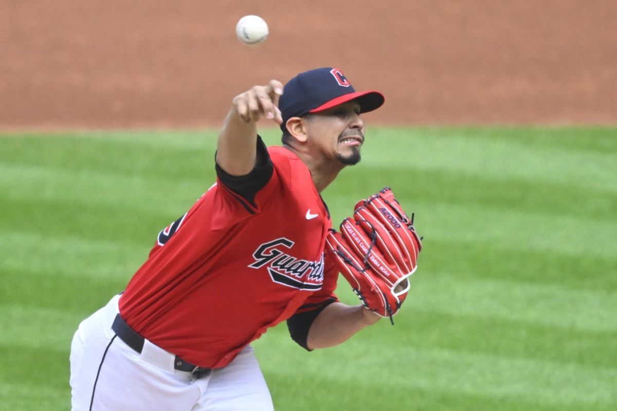 May 5, 2024; Cleveland, Ohio, USA; Cleveland Guardians starting pitcher Carlos Carrasco (59) delivers a pitch in the first inning against the Los Angeles Angels at Progressive Field. Mandatory Credit: David Richard-USA TODAY Sports