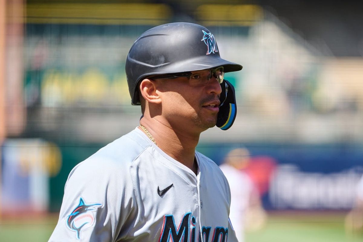 May 5, 2024; Oakland, California, USA; Miami Marlins catcher Christian Bethancourt (25) walks to the dugout after scoring a run against the Oakland Athletics during the sixth inning at Oakland-Alameda County Coliseum. Mandatory Credit: Robert Edwards-USA TODAY Sports