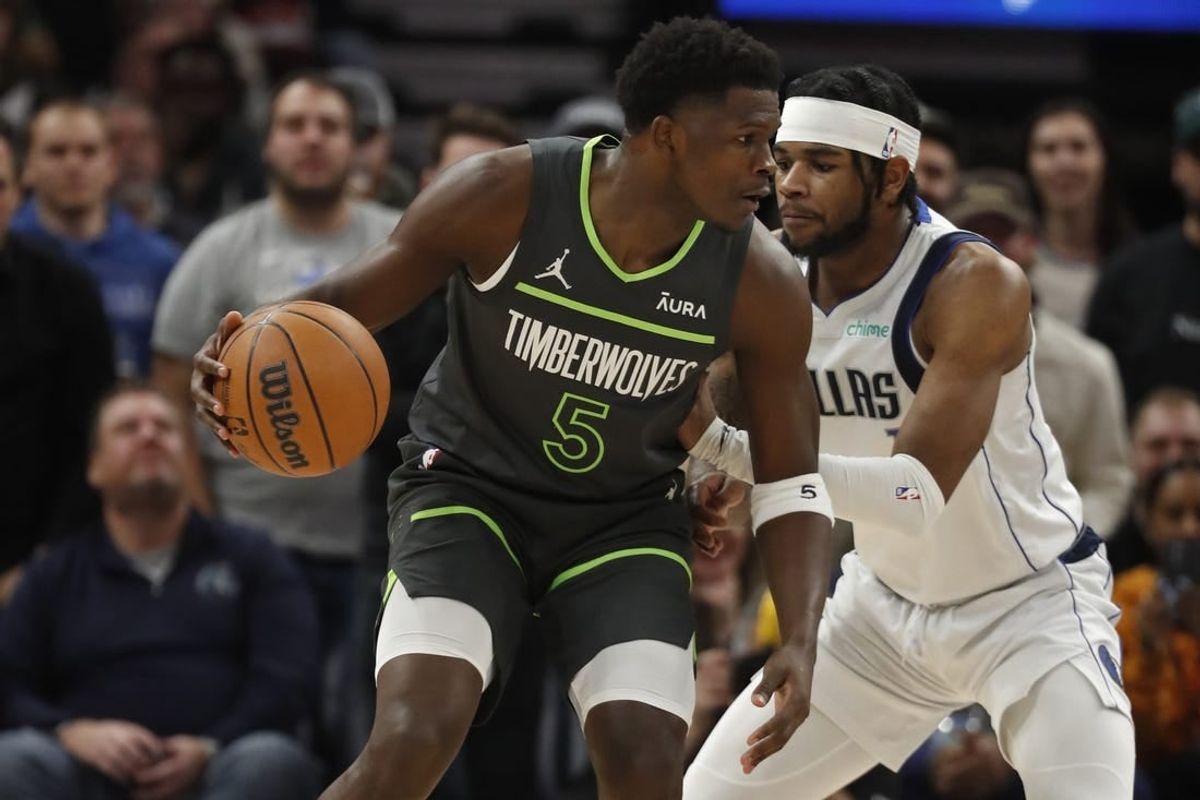 Dec 28, 2023; Minneapolis, Minnesota, USA; Minnesota Timberwolves guard Anthony Edwards (5) works around Dallas Mavericks guard Jaden Hardy (1) in the first quarter at Target Center.