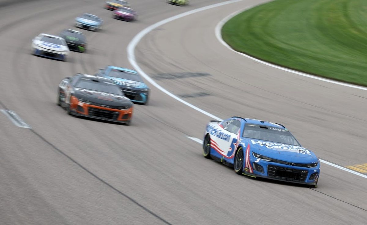 May 5, 2024; Kansas City, Kansas, USA; NASCAR Cup Series driver Kyle Larson (5) leads the pack coming out of turn four during the Advent Health 400 at the Kansas Speedway. Mandatory Credit: Reese Strickland-USA TODAY Sports
