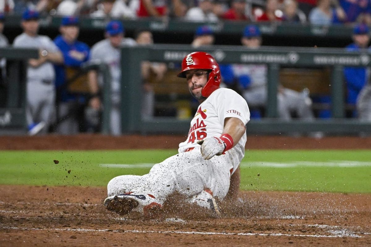 May 6, 2024; St. Louis, Missouri, USA;  St. Louis Cardinals first baseman Paul Goldschmidt (46) slides safely in at home to score against the New York Mets during the sixth inning at Busch Stadium. Mandatory Credit: Jeff Curry-USA TODAY Sports