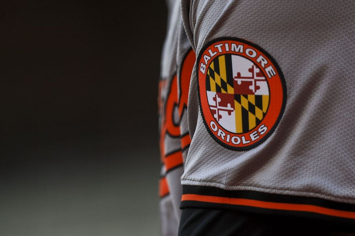 May 5, 2024; Cincinnati, Ohio, USA; The Baltimore Orioles logo on the sleeve of designated hitter Gunnar Henderson (2) as he prepares on deck during the seventh inning against the Cincinnati Reds at Great American Ball Park. Mandatory Credit: Katie Stratman-Imagn Images