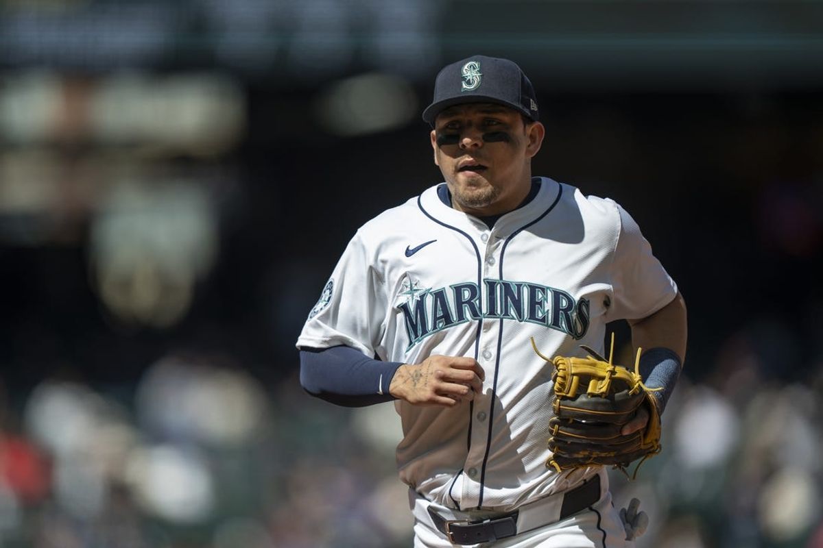 Apr 17, 2024; Seattle, Washington, USA; Seattle Mariners third baseman Luis Urias (16) jogs off the field during a game against the Cincinnati Reds at T-Mobile Park. Mandatory Credit: Stephen Brashear-USA TODAY Sports