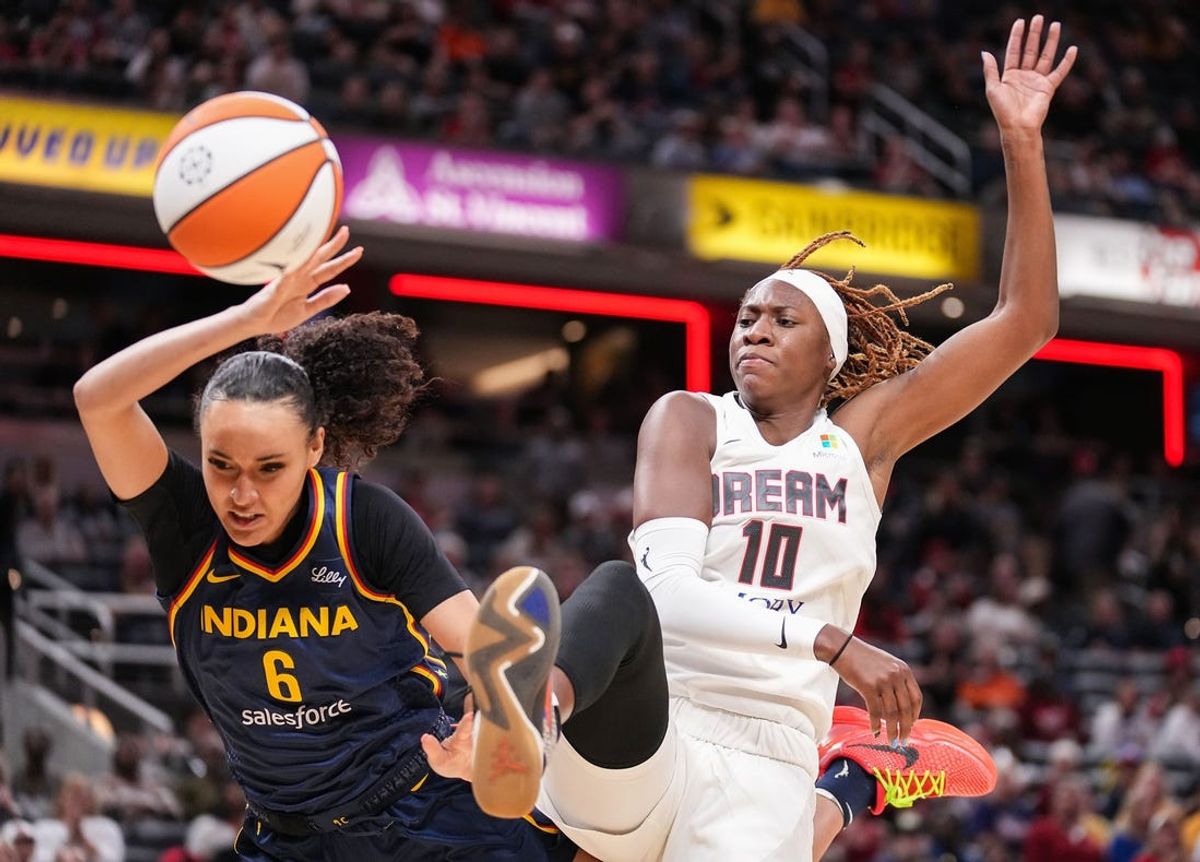 Atlanta Dream guard Rhyne Howard (10) swats the ball against Indiana Fever guard Celesta Taylor (6) on Thursday, May 9, 2024, during the preseason game against the Atlanta Dream at Gainbridge Fieldhouse in Indianapolis.