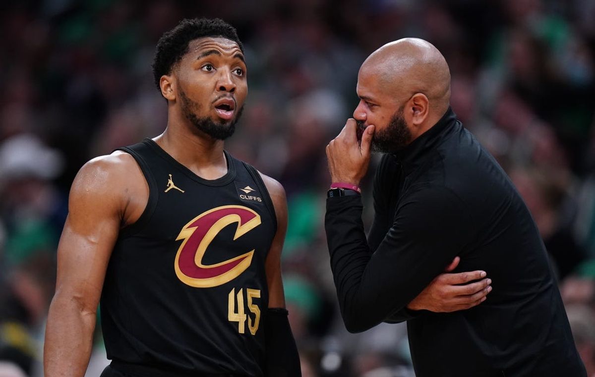 May 9, 2024; Boston, Massachusetts, USA; Cleveland Cavaliers head coach J. B. Bickerstaff talks with guard Donovan Mitchell (45) from the sideline as they take on the Boston Celtics during game two of the second round for the 2024 NBA playoffs at TD Garden. Mandatory Credit: David Butler II-USA TODAY Sports
