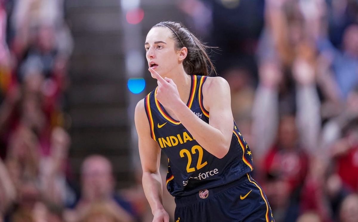 Indiana Fever guard Caitlin Clark (22) reacts to scoring three points Thursday, May 9, 2024, during the preseason game against the Atlanta Dream at Gainbridge Fieldhouse in Indianapolis. The Indiana Fever defeated the Atlanta Dream, 83-80.