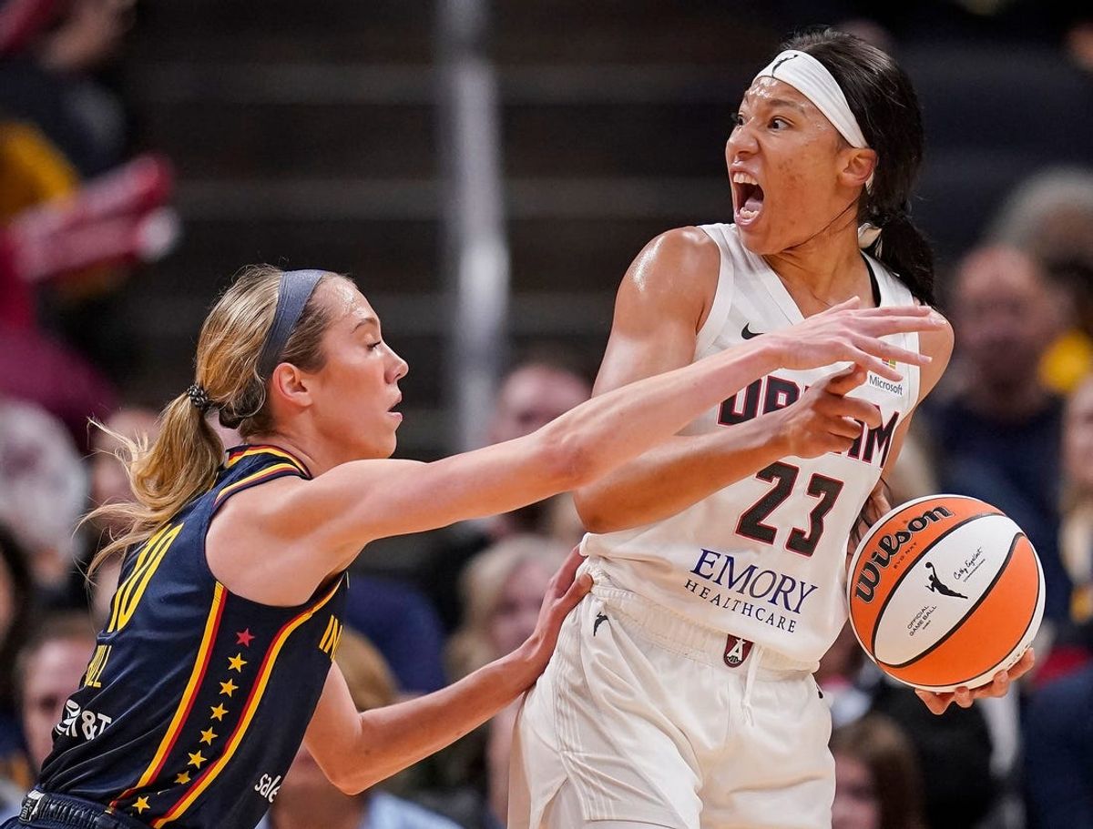 May 9, 2024; Indianapolis, IN, USA; Atlanta Dream guard Aerial Powers (23) yells to teammates as Indiana Fever guard Lexie Hull (10) reaches of the ball Thursday, May 9, 2024, during the preseason game against the Atlanta Dream at Gainbridge Fieldhouse in Indianapolis. The Indiana Fever defeated the Atlanta Dream, 83-80. Mandatory Credit: Grace Hollars-USA TODAY Sports