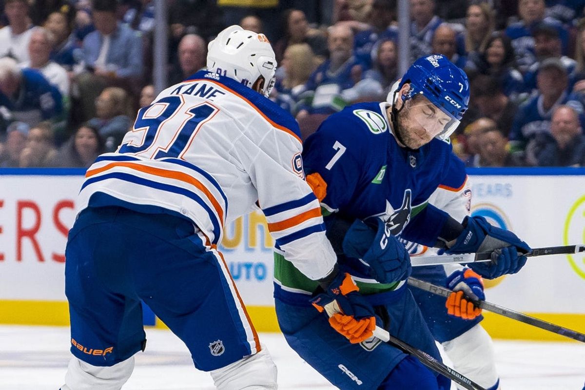 May 10, 2024; Vancouver, British Columbia, CAN; Vancouver Canucks defenseman Carson Soucy (7) checks Edmonton Oilers forward Evander Kane (91) during the second period in game two of the second round of the 2024 Stanley Cup Playoffs at Rogers Arena. Mandatory Credit: Bob Frid-USA TODAY Sports