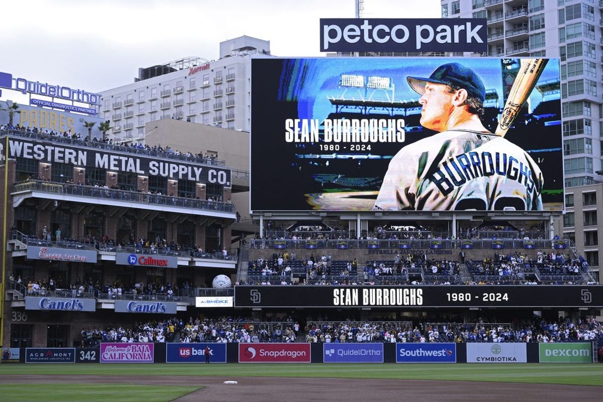 May 10, 2024; San Diego, California, USA; A tribute to former San Diego Padres player Sean Burroughs is displayed on the video board before the game against the Los Angeles Dodgers at Petco Park. Mandatory Credit: Orlando Ramirez-USA TODAY Sports