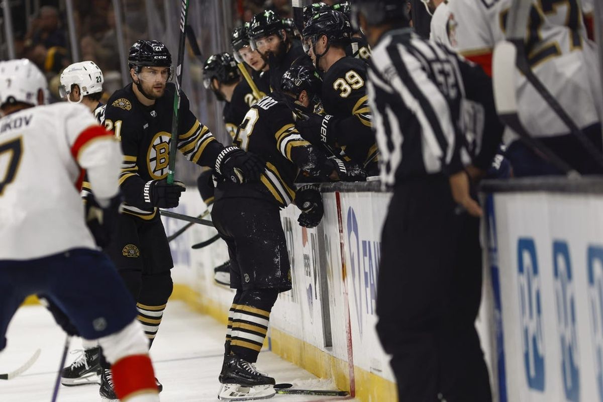May 10, 2024; Boston, Massachusetts, USA; Boston Bruins left wing Brad Marchand (63) struggles to get to the bench after being hit during the first period of game three of the second round of the 2024 Stanley Cup Playoffs against the Florida Panthers at TD Garden. Mandatory Credit: Winslow Townson-USA TODAY Sports