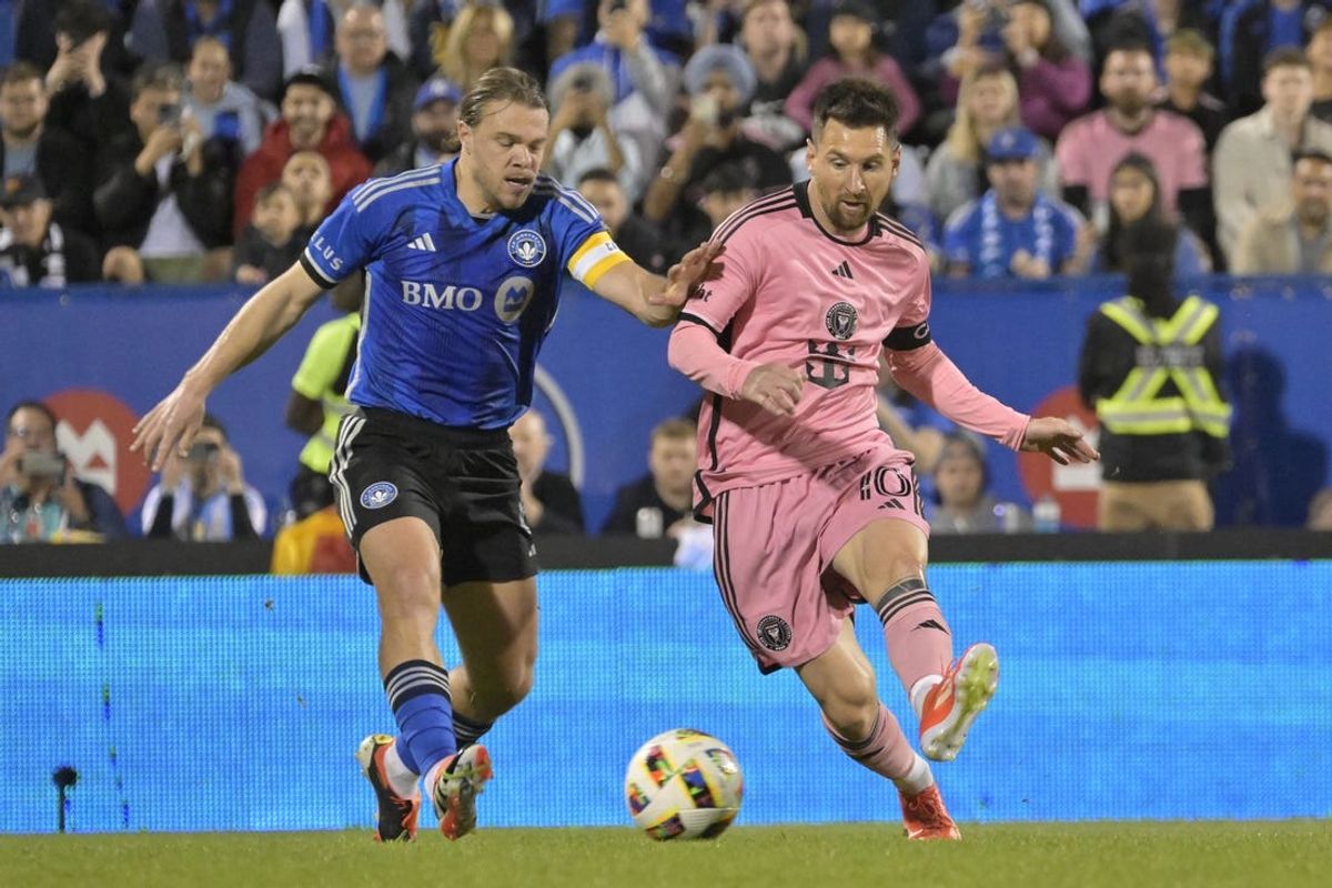 May 11, 2024; Montreal, Quebec, CAN; Inter Miami CF forward Lionel Messi (10) battles for the ball against CF Montreal midfielder Samuel Piette (6) in the second half at Stade Saputo. Mandatory Credit: Eric Bolte-USA TODAY Sports