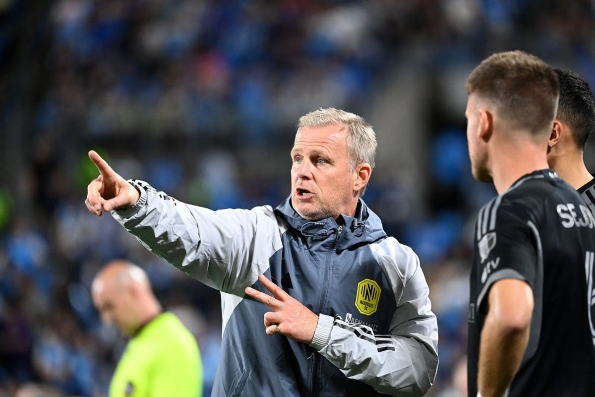 May 11, 2024; Charlotte, North Carolina, USA; Nashville SC head coach Gary Smith with midfielder Amar Sejdic (6) in the second half at Bank of America Stadium. Mandatory Credit: Bob Donnan-USA TODAY Sports