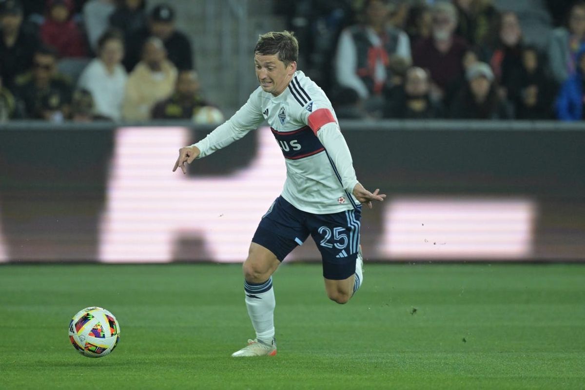 May 11, 2024; Los Angeles, California, USA;  Vancouver Whitecaps FC midfielder Ryan Gauld (25) dribbles the ball during the first half against LAFC at BMO Stadium. Mandatory Credit: Jayne Kamin-Oncea-USA TODAY Sports