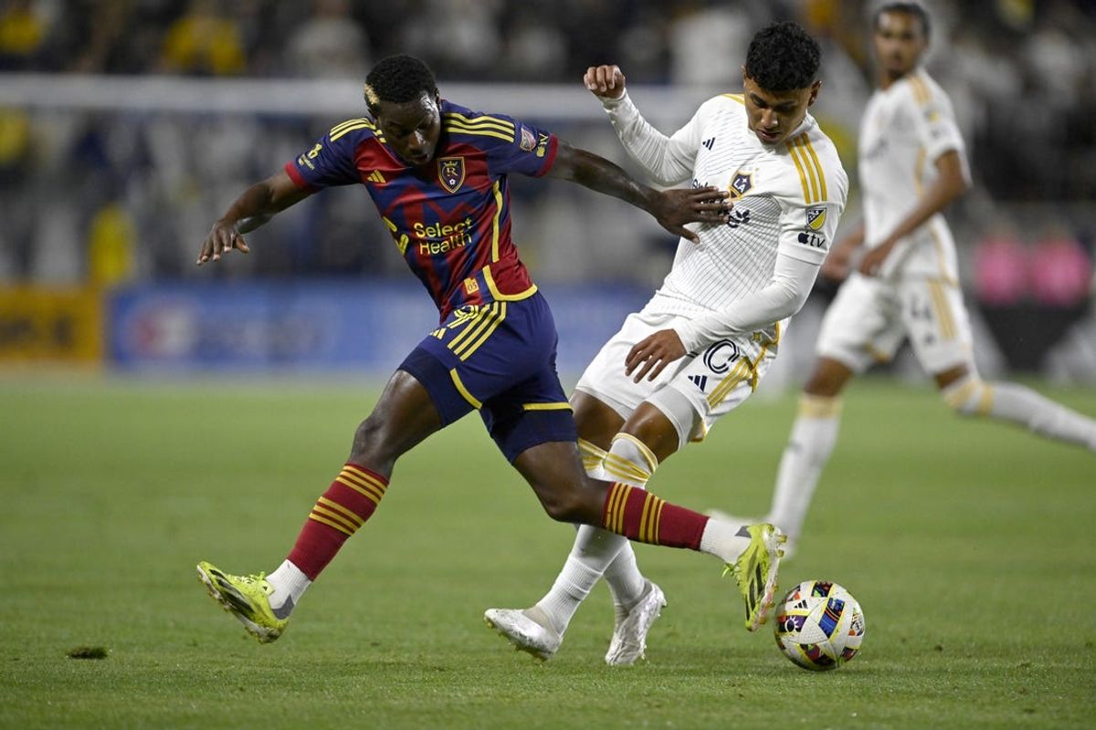 May 11, 2024; Carson, California, USA; Real Salt Lake forward Cristian Arango (9) and LA Galaxy midfielder Edwin Cerrillo (20) fight for a loose ball during the second half at Dignity Health Sports Park. Mandatory Credit: Alex Gallardo-USA TODAY Sports
