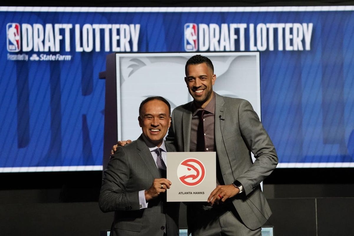 May 12, 2024; Chicago, IL, USA; Atlanta Hawks general manager Landry Fields (right) and Mark TatumDeputy commissioner of the NBA after the Hawks get the number one pick in the 2024 NBA Draft Lottery at McCormick Place West. Mandatory Credit: David Banks-USA TODAY Sports