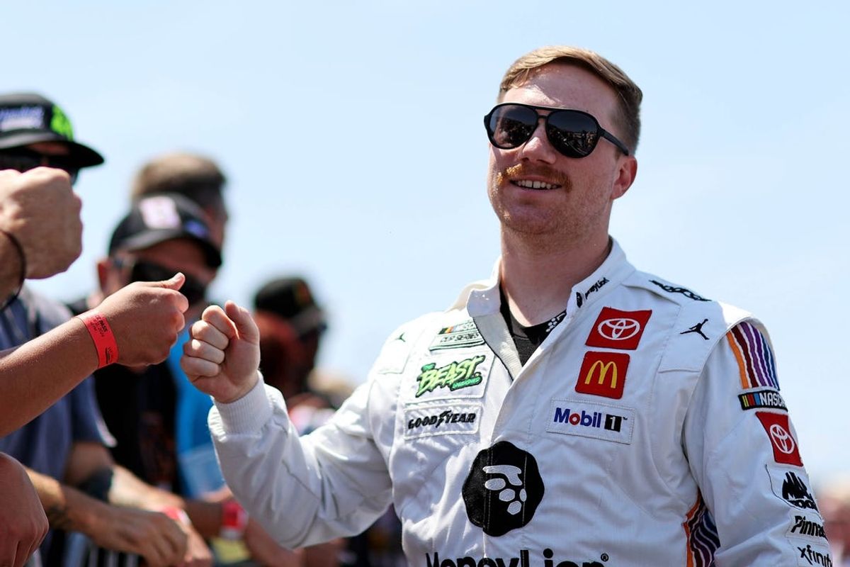 May 12, 2024; Darlington, South Carolina, USA; NASCAR Cup Series driver Ty Gibbs (54) greets fans before the Goodyear 400 at Darlington Raceway. Mandatory Credit: Peter Casey-USA TODAY Sports