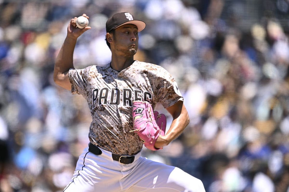 May 12, 2024; San Diego, California, USA; San Diego Padres starting pitcher Yu Darvish (11) throws a pitch against the Los Angeles Dodgers during the first inning at Petco Park. Mandatory Credit: Orlando Ramirez-USA TODAY Sports