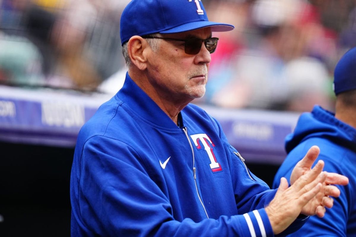 May 12, 2024; Denver, Colorado, USA; Texas Rangers manager Bruce Bochy (15) reacts to a run scored in the first inning against the Colorado Rockies at Coors Field. Mandatory Credit: Ron Chenoy-USA TODAY Sports