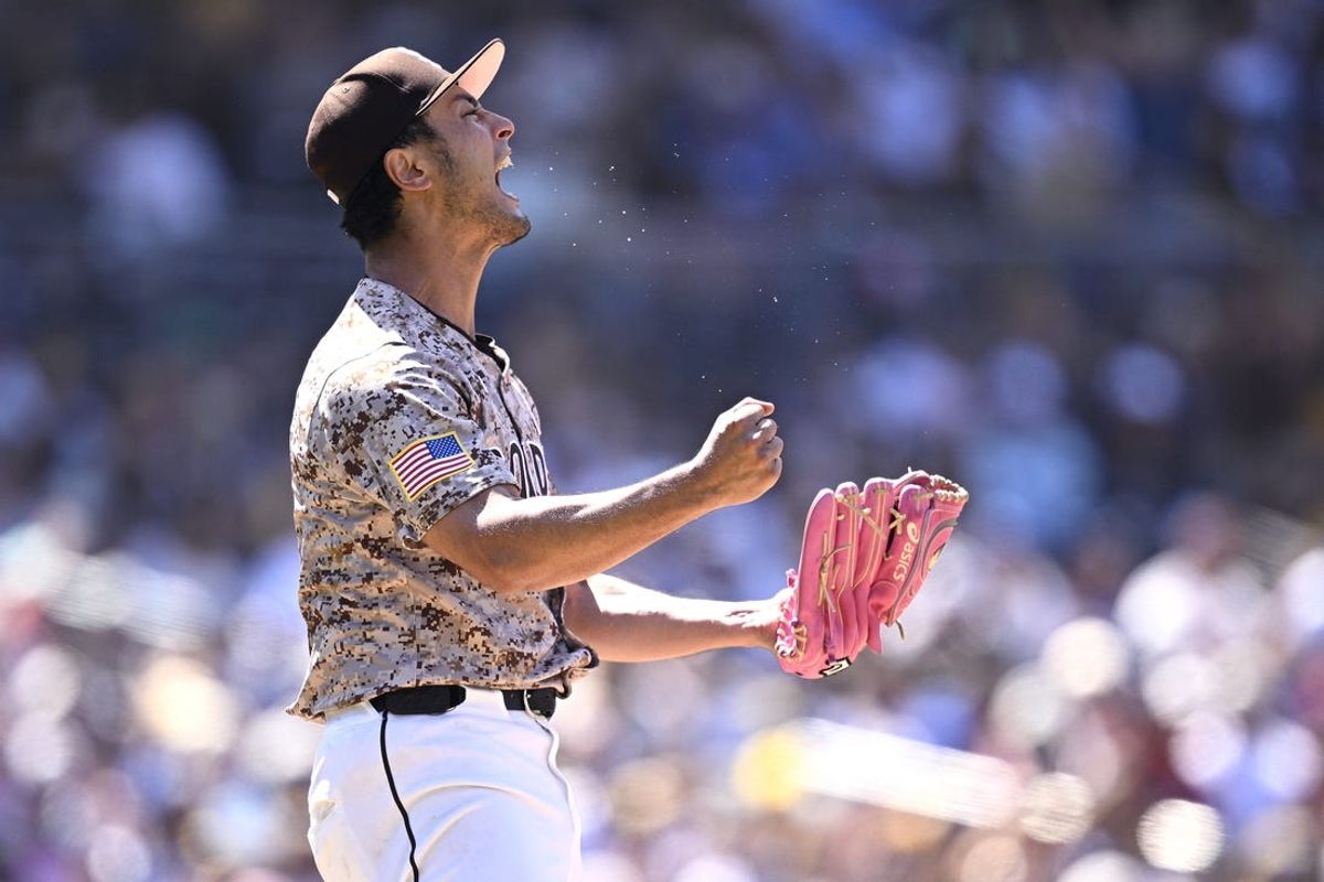 May 12, 2024; San Diego, California, USA; San Diego Padres starting pitcher Yu Darvish (11) celebrates after a strikeout to end the top of the sixth inning against the Los Angeles Dodgers at Petco Park. Mandatory Credit: Orlando Ramirez-USA TODAY Sports