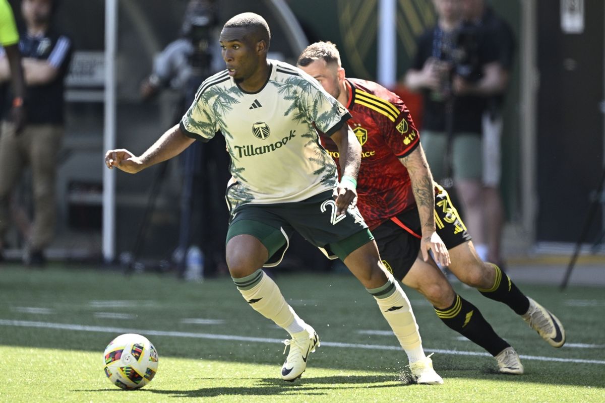 May 12, 2024; Portland, Oregon, USA; Portland Timbers defender Juan Mosquera (29) controls the ball against Seattle Sounders FC forward Jordan Morris (13) in the second half at Providence Park. Mandatory Credit: Troy Wayrynen-USA TODAY Sports