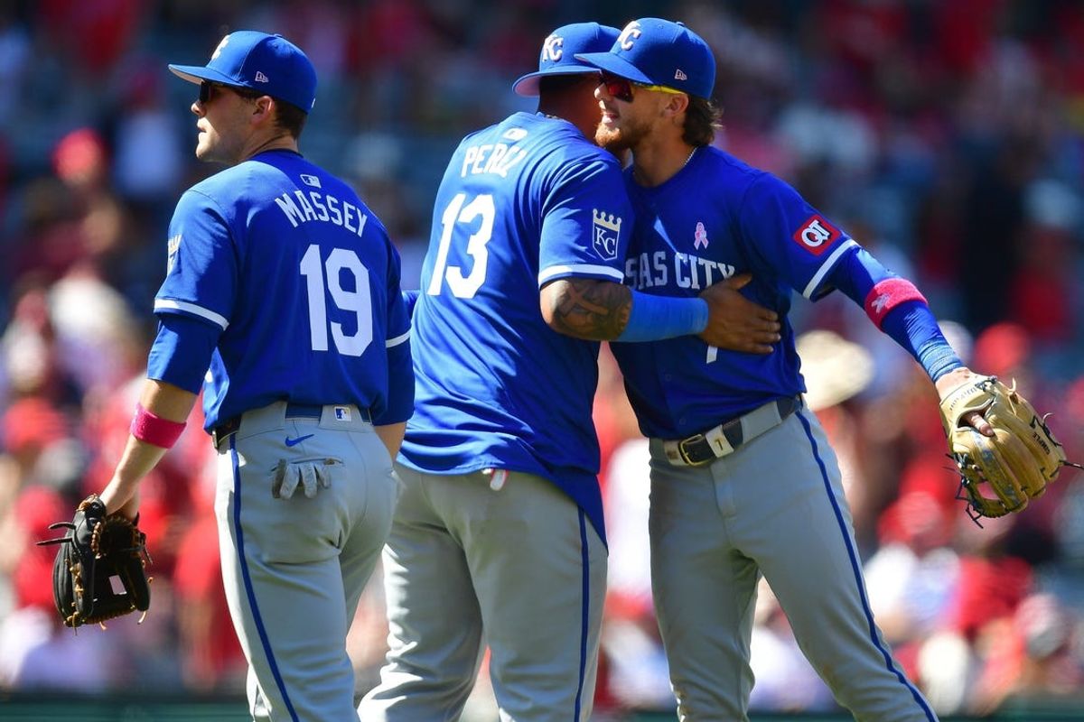 May 12, 2024; Anaheim, California, USA; Kansas City Royals second baseman Michael Massey (19) first baseman Salvador Perez (13) and shortstop Bobby Witt Jr. (7) celebrate the victory against the Los Angeles Angels at Angel Stadium. Mandatory Credit: Gary A. Vasquez-USA TODAY Sports