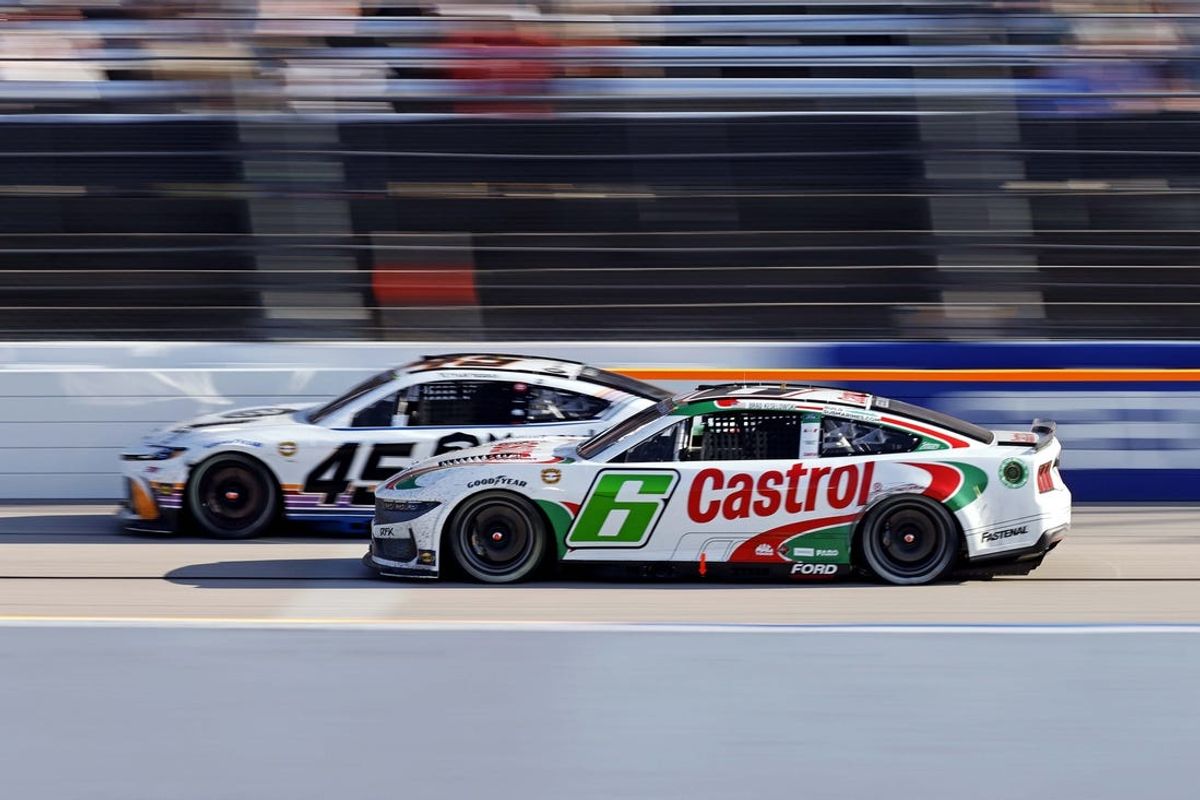 May 12, 2024; Darlington, South Carolina, USA; NASCAR Cup Series driver Brad Keselowski (6) and NASCAR Cup Series driver Tyler Reddick (45) race for the lead during the Goodyear 400 at Darlington Raceway. Mandatory Credit: Peter Casey-USA TODAY Sports