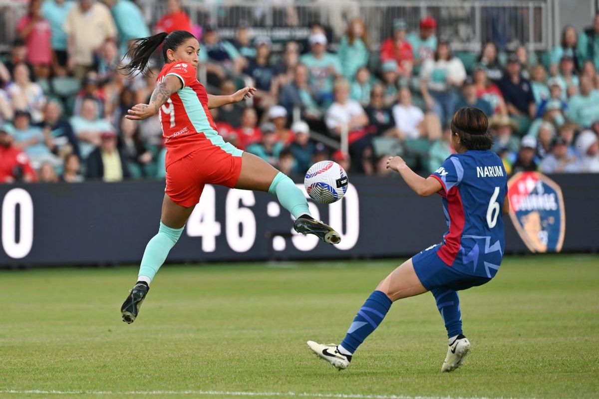 May 12, 2024; Kansas City, Missouri, USA; Kansas City Current midfielder Debinha (99) controls the ball as North Carolina Courage midfielder Narumi Miura (6) defends during the second half at CPKC Stadium. Mandatory Credit: Peter Aiken-USA TODAY Sports