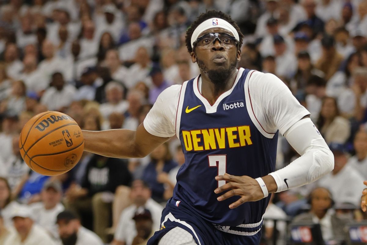 May 12, 2024; Minneapolis, Minnesota, USA; Denver Nuggets guard Reggie Jackson (7) goes to the basket against the Minnesota Timberwolves in the first quarter of game four of the second round for the 2024 NBA playoffs at Target Center. Mandatory Credit: Bruce Kluckhohn-USA TODAY Sports