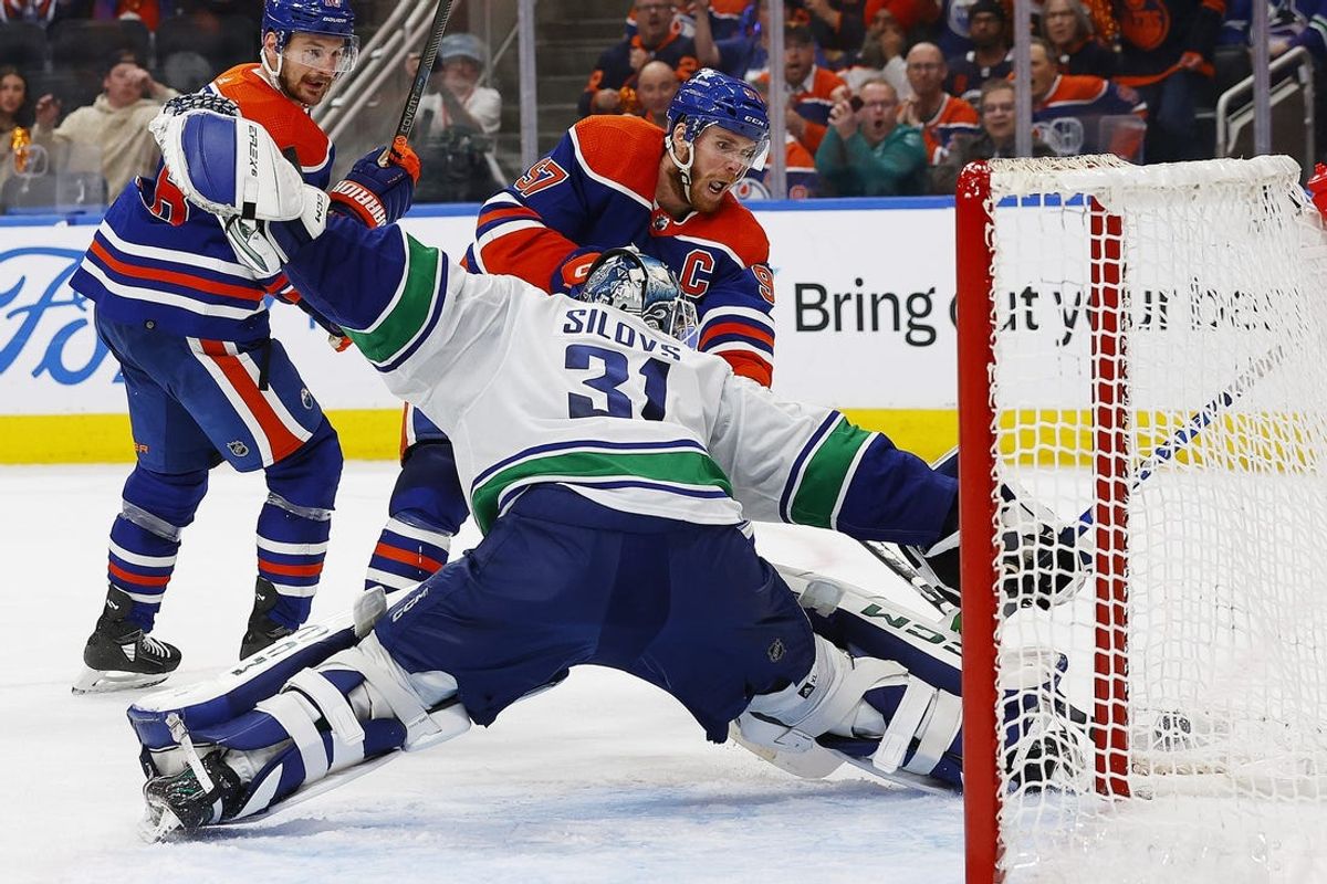 May 12, 2024; Edmonton, Alberta, CAN; Vancouver Canucks goaltender Arturs Silovs (31) makes a save on  on Edmonton Oilers forward Connor McDavid (97) during the third period in game three of the second round of the 2024 Stanley Cup Playoffs at Rogers Place. Mandatory Credit: Perry Nelson-USA TODAY Sports