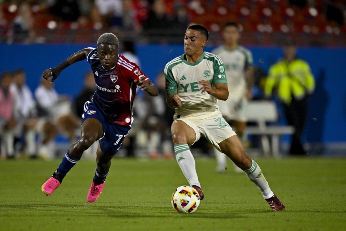 May 11, 2024; Frisco, Texas, USA; FC Dallas forward Bernard Kamungo (77) and Austin FC midfielder Owen Wolff (33) in action during the game between FC Dallas and Austin FC at Toyota Stadium. Mandatory Credit: Jerome Miron-USA TODAY Sports