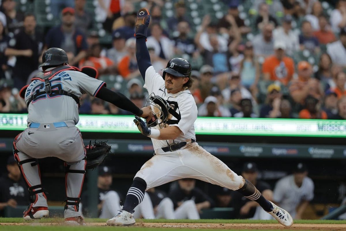May 13, 2024; Detroit, Michigan, USA;  Detroit Tigers shortstop Zach McKinstry (39) is tagged out by Miami Marlins catcher Christian Bethancourt (25) in the fourth inning at Comerica Park. Mandatory Credit: Rick Osentoski-USA TODAY Sports