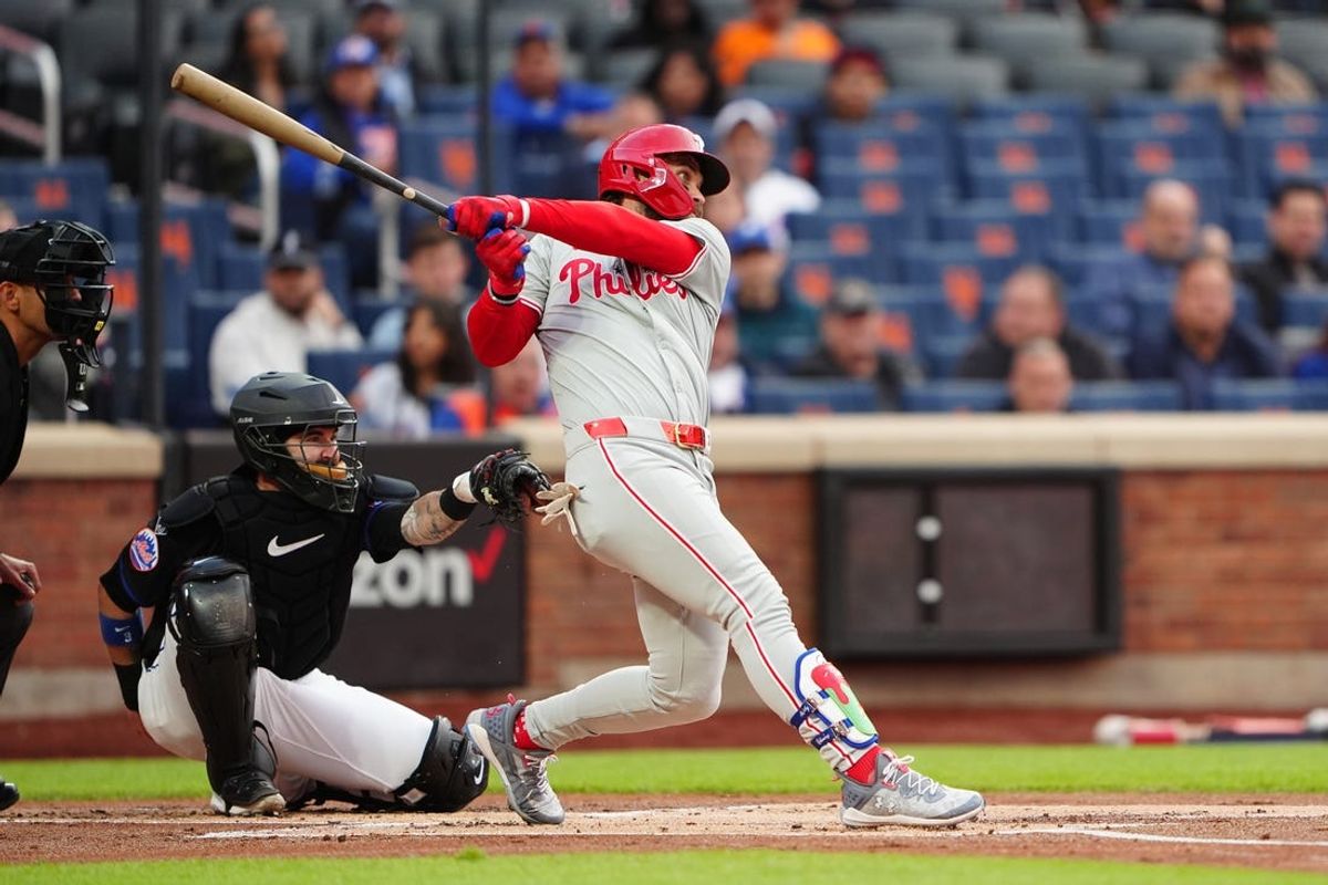 May 13, 2024; New York City, New York, USA; Philadelphia Phillies first baseman Bryce Harper (3) hits a single against the New York Mets during the first inning at Citi Field. Mandatory Credit: Gregory Fisher-USA TODAY Sports