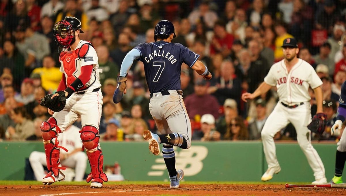 May 13, 2024; Boston, Massachusetts, USA; Tampa Bay Rays shortstop Jose Caballero (7) scores against the Boston Red Sox in the forth inning at Fenway Park. Mandatory Credit: David Butler II-USA TODAY Sports