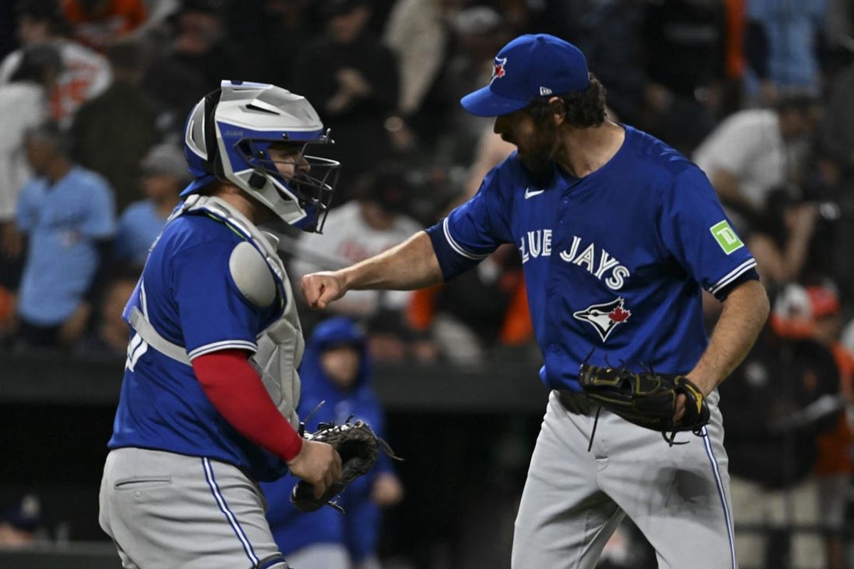 May 13, 2024; Baltimore, Maryland, USA;  Toronto Blue Jays pitcher Jordan Romano (68) and catcher Alejandro Kirk (30) celebrates after the game against the Baltimore Orioles at Oriole Park at Camden Yards. Mandatory Credit: Tommy Gilligan-USA TODAY Sports
