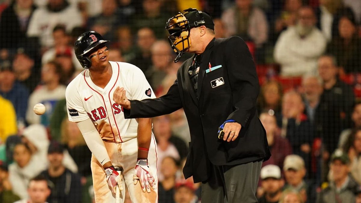 May 13, 2024; Boston, Massachusetts, USA; Boston Red Sox third baseman Rafael Devers (11) reacts to the umpire after striking out with two on base ending the eighth inning against the Tampa Bay Rays at Fenway Park. Mandatory Credit: David Butler II-USA TODAY Sports