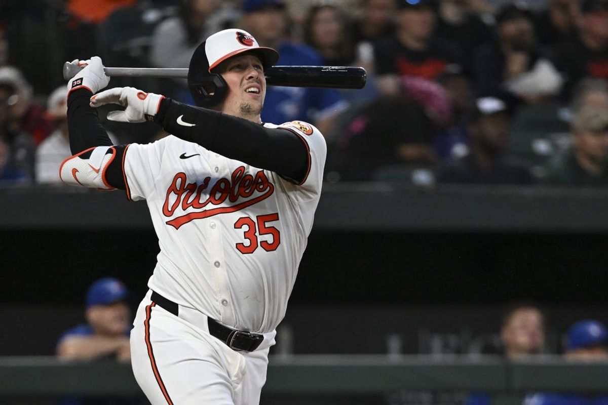 May 13, 2024; Baltimore, Maryland, USA;  Baltimore Orioles catcher Adley Rutschman (35) swings through  a sixth inning solo homerun against the Toronto Blue Jays at Oriole Park at Camden Yards. Mandatory Credit: Tommy Gilligan-USA TODAY Sports