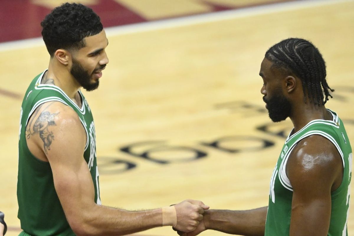 May 13, 2024; Cleveland, Ohio, USA; Boston Celtics forward Jayson Tatum (0) and guard Jaylen Brown (7) celebrate after a win over the Cleveland Cavaliers in game four of the second round for the 2024 NBA playoffs at Rocket Mortgage FieldHouse. Mandatory Credit: David Richard-USA TODAY Sports