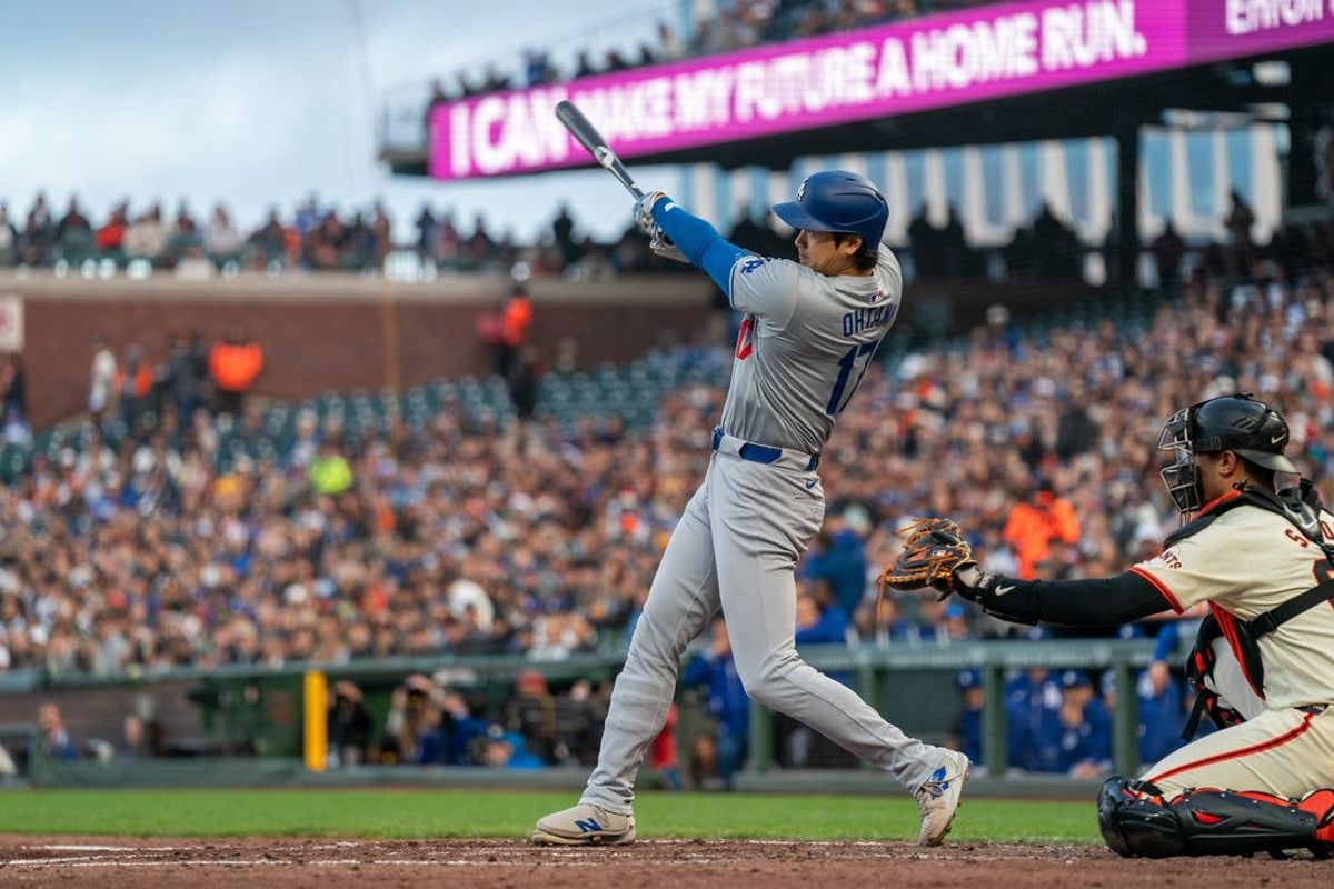 May 13, 2024; San Francisco, California, USA; Los Angeles Dodgers designated hitter Shohei Ohtani (17) hits a single against the San Francisco Giants during the third inning at Oracle Park. Mandatory Credit: Neville E. Guard-USA TODAY Sports