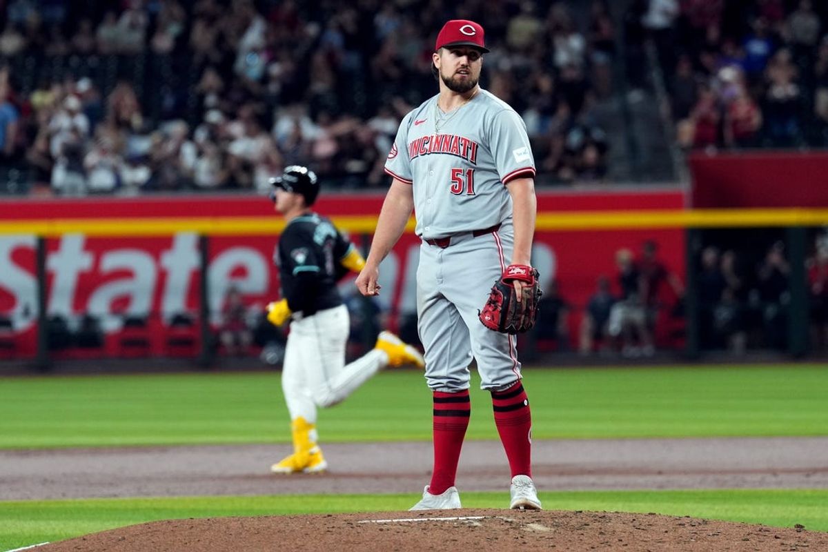 May 13, 2024; Phoenix, Arizona, USA; Cincinnati Reds pitcher Graham Ashcraft (51) reacts after giving up a solo home run to Arizona Diamondbacks designated hitter Joc Pederson (3) during the third inning at Chase Field. Mandatory Credit: Joe Camporeale-USA TODAY Sports