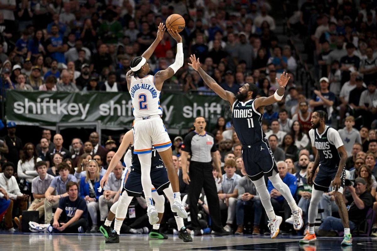 May 13, 2024; Dallas, Texas, USA; Oklahoma City Thunder guard Shai Gilgeous-Alexander (2) makes a jump shot over Dallas Mavericks guard Kyrie Irving (11) during the second half in game four of the second round for the 2024 NBA playoffs at American Airlines Center. Mandatory Credit: Jerome Miron-USA TODAY Sports