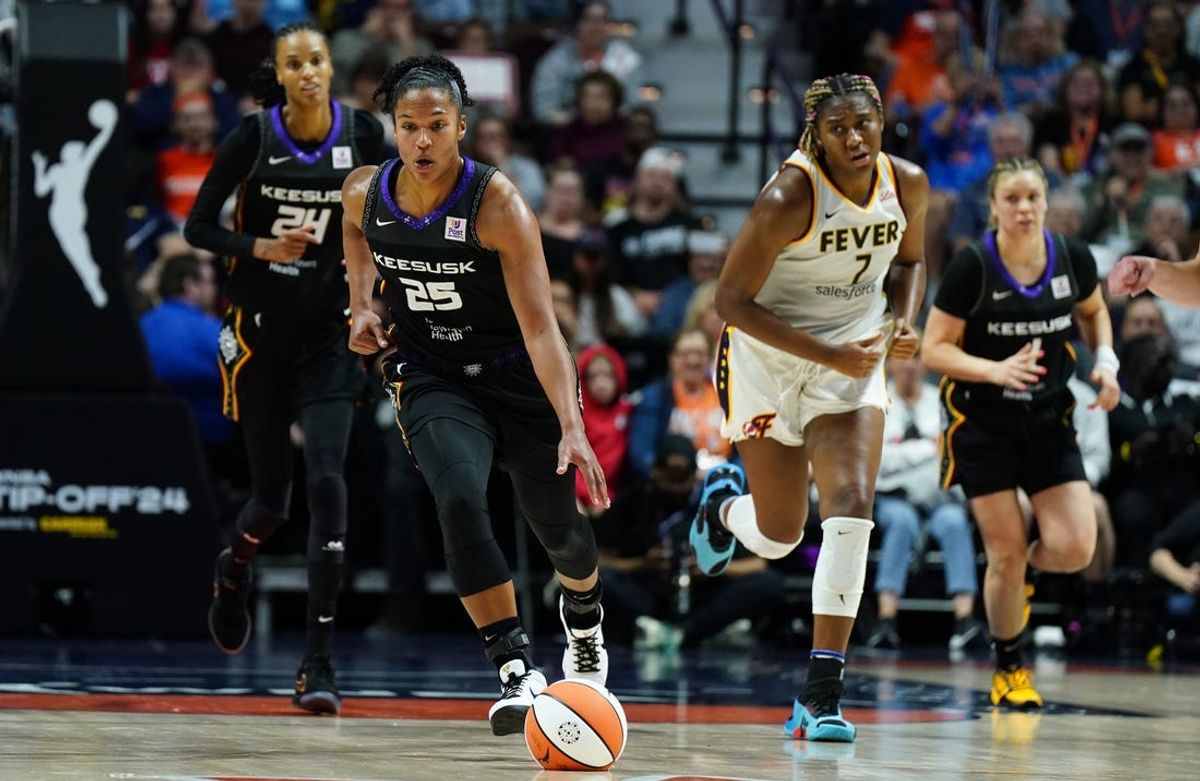 May 14, 2024; Uncasville, Connecticut, USA; Connecticut Sun forward Alyssa Thomas (25) returns the ball against the Indiana Fever in the second half at Mohegan Sun Arena. Mandatory Credit: David Butler II-USA TODAY Sports