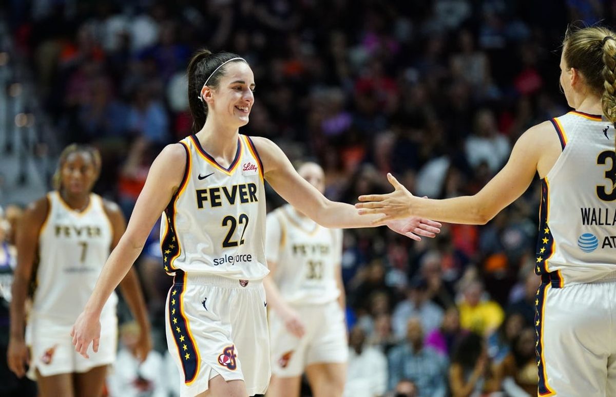 May 14, 2024; Uncasville, Connecticut, USA; Indiana Fever guard Caitlin Clark (22) reacts with guard Kristy Wallace (3) during a break in the action against the Connecticut Sun in the second half at Mohegan Sun Arena. Mandatory Credit: David Butler II-USA TODAY Sports